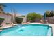 Relaxing pool with a waterfall feature and an outdoor dining set, perfect for enjoying sunny days at 18198 E El Viejo Desierto --, Gold Canyon, AZ 85118