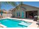 Backyard oasis featuring a refreshing pool, covered patio, and lush landscaping at 18198 E El Viejo Desierto --, Gold Canyon, AZ 85118