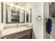 Bathroom featuring vanity with a stone countertop, towel rack, and mirror at 19302 W Melvin St, Buckeye, AZ 85326