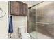 Bathroom with shower, toilet, and cabinets at 19302 W Melvin St, Buckeye, AZ 85326
