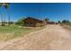 Wide shot of this charming single-story home with desert landscaping, large yard and extended driveway at 19302 W Melvin St, Buckeye, AZ 85326
