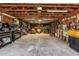 Spacious garage interior with high ceilings, abundant storage, and workshop space at 19302 W Melvin St, Buckeye, AZ 85326