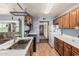 Bright kitchen featuring stainless steel appliances, wood cabinets, and laminate countertops at 19302 W Melvin St, Buckeye, AZ 85326