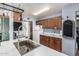 Kitchen with a large stainless steel sink, wood cabinets, and ample counter space at 19302 W Melvin St, Buckeye, AZ 85326