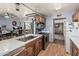 Kitchen with stainless steel appliances, wooden cabinets, and a pot rack at 19302 W Melvin St, Buckeye, AZ 85326