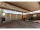 Spacious carport area with covered parking and ample room for storage or workshop activities at 19302 W Melvin St, Buckeye, AZ 85326