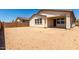 Spacious backyard awaiting landscaping with a covered patio attached to the home at 19338 S 212Th Pl, Queen Creek, AZ 85142