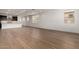 Open-concept living area featuring beautiful hardwood floors and recessed lighting at 19338 S 212Th Pl, Queen Creek, AZ 85142