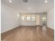 Bright living space with large windows and wood floors at 19338 S 212Th Pl, Queen Creek, AZ 85142