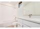 Clean and modern bathroom featuring a tub/shower combo and a sleek vanity at 19354 S 212Th Pl, Queen Creek, AZ 85142