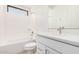 All white bathroom with a shower-tub combo, single sink vanity, and large mirror at 19354 S 212Th Pl, Queen Creek, AZ 85142