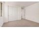 Bright bedroom featuring neutral carpet, and a large closet with sliding doors at 19354 S 212Th Pl, Queen Creek, AZ 85142