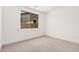 Neutral carpeted bedroom showcasing a view from the window and minimal design at 19354 S 212Th Pl, Queen Creek, AZ 85142