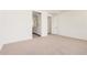 Bedroom featuring neutral carpet and a view to an ensuite bathroom at 19354 S 212Th Pl, Queen Creek, AZ 85142