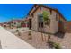Beautiful home with desert landscaping, stone accents, and a charming front yard at 19354 S 212Th Pl, Queen Creek, AZ 85142