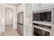Kitchen featuring stainless steel refrigerator, microwave, oven, and white cabinetry at 19354 S 212Th Pl, Queen Creek, AZ 85142
