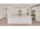 Open kitchen with a large island, stainless steel appliances, and white cabinetry at 19354 S 212Th Pl, Queen Creek, AZ 85142