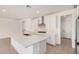 Open kitchen with a large island, stainless steel appliances, and white cabinetry at 19354 S 212Th Pl, Queen Creek, AZ 85142