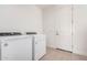 Functional laundry room equipped with a modern washer and dryer at 19354 S 212Th Pl, Queen Creek, AZ 85142