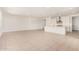 Open living area featuring light tile flooring and an adjacent kitchen at 19354 S 212Th Pl, Queen Creek, AZ 85142