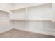 Spacious walk-in closet with built-in shelving and ample storage space at 19354 S 212Th Pl, Queen Creek, AZ 85142