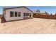 A spacious backyard with a covered patio provides lots of room for personalization and landscaping at 19434 S 212Th Pl, Queen Creek, AZ 85142