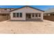 Expansive backyard view featuring a covered patio and ample space for landscaping and recreation at 19434 S 212Th Pl, Queen Creek, AZ 85142