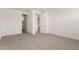 Spacious carpeted bedroom with white walls and doors, showcasing a bright and modern design at 19434 S 212Th Pl, Queen Creek, AZ 85142