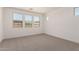Bedroom with neutral carpeting and abundant natural light coming through multiple windows at 19434 S 212Th Pl, Queen Creek, AZ 85142