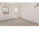Well-lit bedroom featuring neutral carpet, multiple windows, and ample natural light at 19434 S 212Th Pl, Queen Creek, AZ 85142
