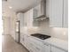 Updated kitchen featuring stainless steel refrigerator, built-in gas range, and white countertops at 19434 S 212Th Pl, Queen Creek, AZ 85142