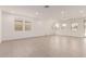 Bright, open living room featuring tile flooring and multiple windows offering natural light at 19434 S 212Th Pl, Queen Creek, AZ 85142