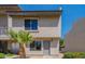 Charming two-story townhouse with desert landscaping and a gray front door at 19601 N 7Th St # 1003, Phoenix, AZ 85024
