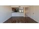 Living Room featuring kitchen pass-through and wood-look floors at 19601 N 7Th St # 1003, Phoenix, AZ 85024