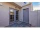 Private patio area featuring slate tile and double doors to the kitchen at 19601 N 7Th St # 1003, Phoenix, AZ 85024