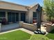 Backyard featuring multiple outdoor seating areas and covered patio space at 19882 N Crimson Ridge Way, Surprise, AZ 85374