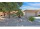 Charming single-story home with low maintenance desert landscaping, rock mulch and a two car garage at 19882 N Crimson Ridge Way, Surprise, AZ 85374