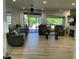 Open living room with access to outdoor patio and comfortable seating at 19882 N Crimson Ridge Way, Surprise, AZ 85374