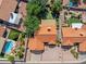 Overhead aerial shot of a home with a tile roof, mature landscaping, and a backyard with a covered patio at 20352 N 109Th Dr, Peoria, AZ 85373