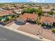 Aerial view of a well-maintained home with a three-car garage, desert landscaping, and a private backyard at 20352 N 109Th Dr, Peoria, AZ 85373