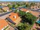 Scenic aerial view of a residential neighborhood with well-kept homes, mature trees, and community lakes and parks at 20352 N 109Th Dr, Peoria, AZ 85373
