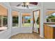 Sunlit breakfast nook boasts a ceiling fan, backyard views and a door to the outside at 20352 N 109Th Dr, Peoria, AZ 85373