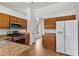 Spacious kitchen features stainless steel appliances, tile floors, and wood cabinets at 20352 N 109Th Dr, Peoria, AZ 85373