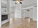 Bright and spacious living room with fireplace and tile flooring leading to the entrance at 20352 N 109Th Dr, Peoria, AZ 85373
