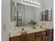 Bathroom featuring a double sink vanity, framed mirrors, and stylish lighting at 205 N 74Th St # 261, Mesa, AZ 85207