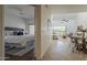 View from hallway of the living room and a well-lit bedroom with a queen-size bed at 205 N 74Th St # 261, Mesa, AZ 85207