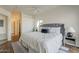 Bright bedroom featuring a large bed, natural light, wood floors, and a walk-in closet at 205 N 74Th St # 261, Mesa, AZ 85207