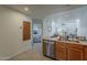 Open-concept kitchen featuring stainless steel appliances and a view into the living room and bedroom at 205 N 74Th St # 261, Mesa, AZ 85207
