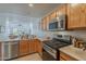 Contemporary kitchen featuring stainless steel appliances and plenty of counter space at 205 N 74Th St # 261, Mesa, AZ 85207