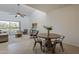 Open living room with vaulted ceilings, a ceiling fan, and a dining table with four chairs at 205 N 74Th St # 261, Mesa, AZ 85207